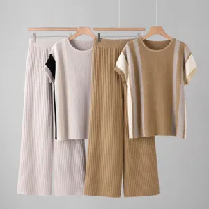 Detailed view of the stylish pleated knit two-piece set featuring short sleeve top and wide leg pants.