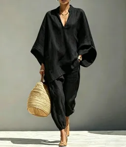 Detailed view of black batwing sleeve top and cuffed pants set in a relaxed casual style.