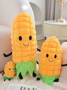 Set de peluche de maíz tierno, detalle de cojín de verdura suave con cara sonriente y hoja verde.