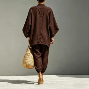 Detail view of casual loose batwing sleeve top and trousers set in elegant brown tone.