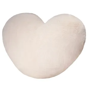 Soft heart shaped plush pillow, Nordic style fluffy faux fur cushion for cozy bedroom decor.