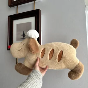 Detail shot of the cute chef baguette dog plush pillow, soft texture and creative bread shape.