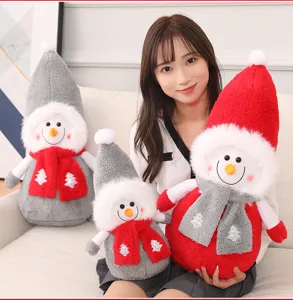 Cute Christmas snowman plush toy with festive scarf and hat, soft holiday doll detail view.