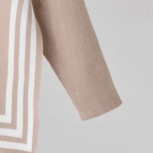 Detailed view of fashionable knit sweater sleeve with contrast parallel stripes design.