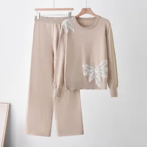 Knit sweater and wide-leg pants set, elegant beaded butterfly decor, stylish autumn outfit.