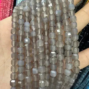 Detailed macro shot of 6mm grey faceted square natural stone beads for DIY jewelry making