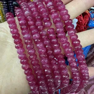 High quality close-up of faceted magenta natural stone abacus beads for DIY jewelry making