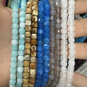 Close-up of 6mm faceted natural stone cube beads for DIY jewelry making in multiple colors