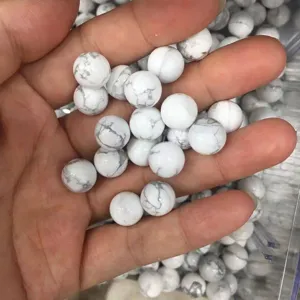 Detailed macro view of white marbled natural stone round beads for DIY jewelry accessories