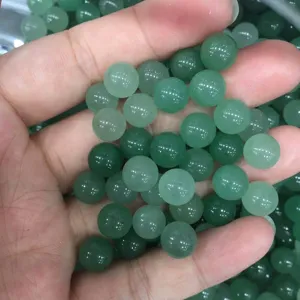 Close-up of natural green round loose beads for DIY jewelry making accessories