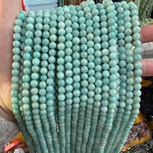 Vista detallada de hilos de cuentas redondas de piedra natural Amazonita A+ para joyería DIY