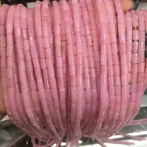 Close-up detail of 4x7mm natural pink agate tube beads for DIY jewelry bracelet making