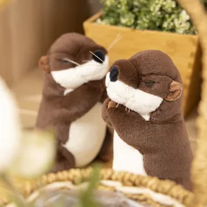 Cute praying otter plush toy doll, soft stuffed animal toy for kids home decor.