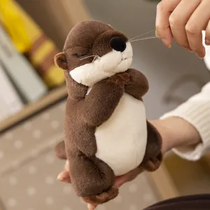 Cute praying otter plush toy, soft stuffed animal doll with sweet sleeping face for gifts.