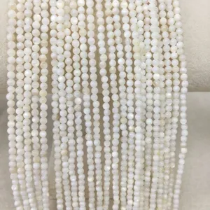 Close-up view of 4mm white shell round beads strands for DIY jewelry making supplies
