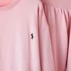 Pink knit sweater set featuring crewneck long sleeve top and matching bottoms with embroidery.