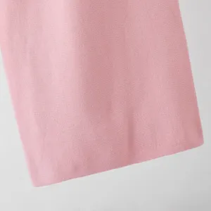 Pink knit fabric detail close up showing soft texture and fine weave pattern for apparel.