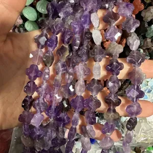 Close-up detail of 12mm faceted amethyst clover loose beads for DIY bracelet and necklace