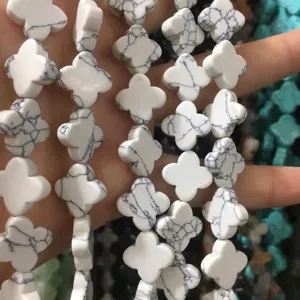 Close-up of white marble four-leaf clover beads for DIY jewelry making accessories