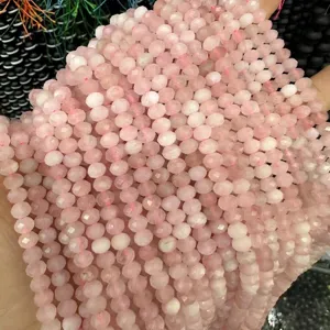 Close-up macro view of 3x5mm light pink faceted natural stone abacus beads for DIY jewelry