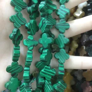 Detail view of green malachite clover beads for DIY jewelry making and bracelet design