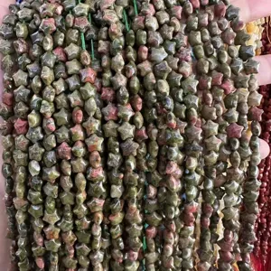 Close-up view of 8mm star-shaped Unakite natural stone beads for DIY jewelry making