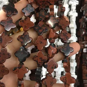Close-up of four-leaf clover brown natural stone beads for DIY jewelry making