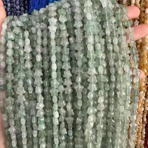Close-up of 8mm light green star-shaped natural stone beads for DIY jewelry making