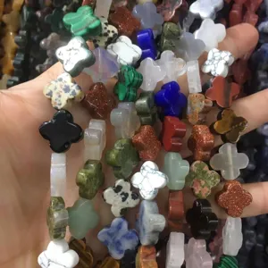 Handful of colorful natural stone clover beads for DIY jewelry making and crafting