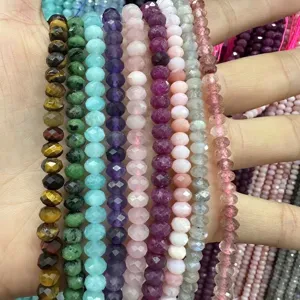 Close-up of assorted natural stone 3x5mm faceted rondelle beads for jewelry making