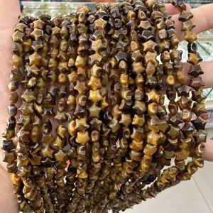 Close-up detail of 8mm star shaped natural tiger eye stone beads for DIY jewelry