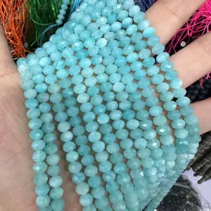 Macro view of light blue faceted 3x5mm natural stone rondelle beads for DIY jewelry