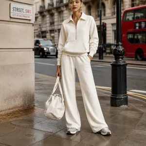 Women casual half-zip sweatshirt and wide-leg sweatpants two-piece set in off-white.