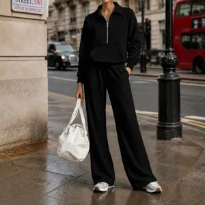 Women black half-zip sweatshirt and wide-leg trousers casual tracksuit two-piece set for autumn.
