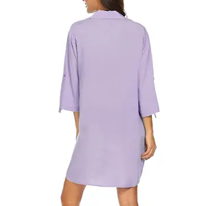 Detail view of the elegant light purple women's shirt dress, stylish beach cover-up.
