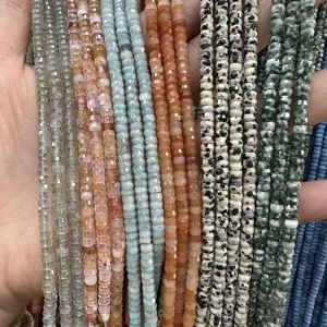 Detalle de cuentas de rueda de piedra natural tallada de 2x4mm para bisutería