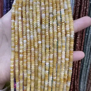 Vista detallada de cuentas rondelle de piedra natural amarilla tallada 2x4mm para joyas DIY