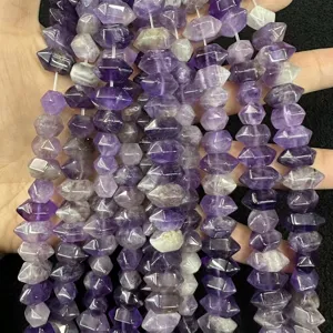 Close-up of natural purple amethyst hexagonal column loose beads for DIY jewelry making