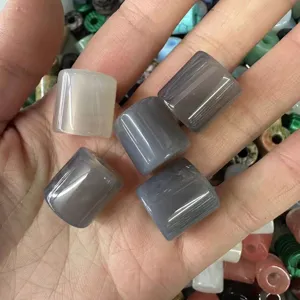 Close-up macro shot of 9x9mm natural stone cylindrical beads for DIY jewelry making accessories