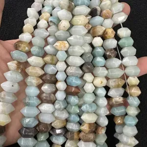 Close-up of natural stone hexagonal column beads showing textures and colors