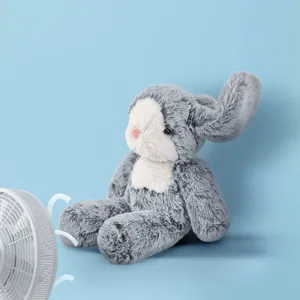 Close-up of the grey plush bunny doll with white face patch and soft fluffy texture for kids.
