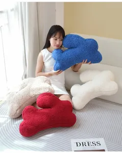 Detailed view of soft irregular plush rabbit ear pillow, cozy living room decor cushion.