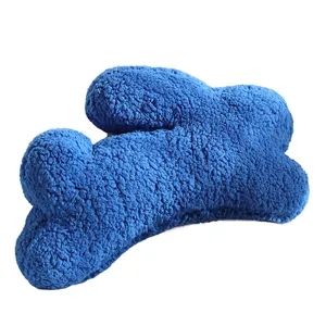 Blue plush throw pillow, soft fuzzy irregular decorative cushion for sofa and bed.