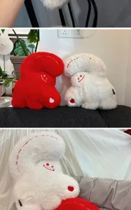Cute giant plush heart hug pillow detail, soft material, smiling face embroidery, cozy room decor.