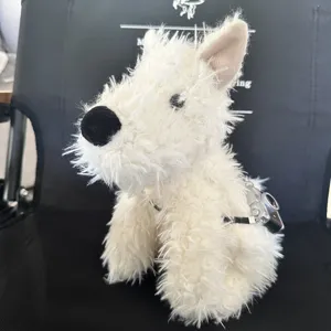 Cute white westie dog plush toy detail view featuring fluffy fur and cute mini camera.