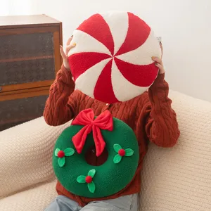 Christmas candy striped round pillow and wreath plush cushion for festive home decor.