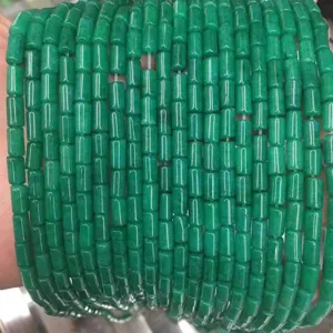 Macro view of polished green agate cylindrical stone beads for DIY necklace bracelets