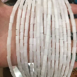 Close-up of natural white agate cylindrical tube beads for DIY jewelry making