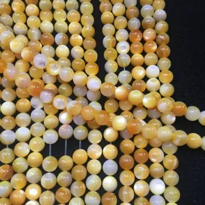 Perline naturali in madreperla gialla con lucentezza cangiante per gioielli fai da te