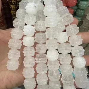 Macro detail of natural white stone drum-shaped beads for DIY jewelry making